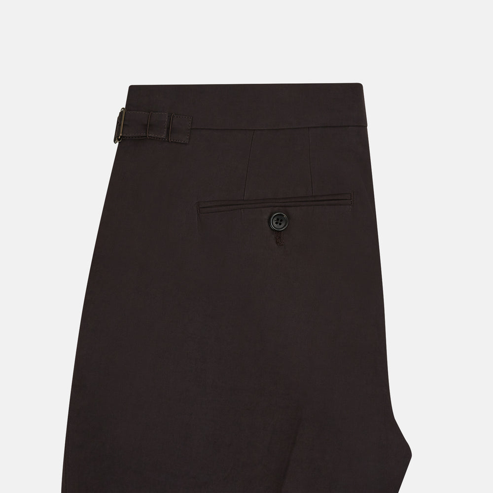 A pair of brown linen Henry trousers by Turnbull & Asser with a straight-leg cut and button waistband, ideal for formalwear, displayed against a plain white background.