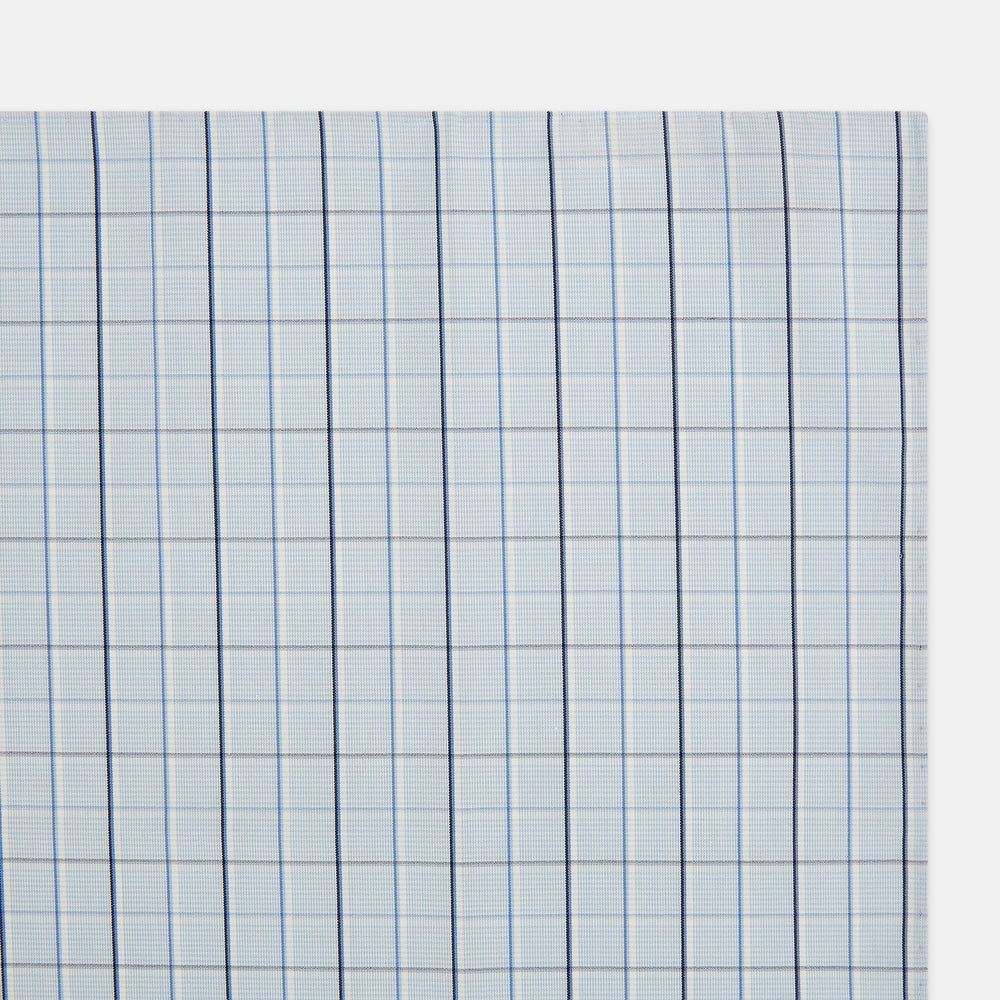 The Turnbull & Asser Navy and Blue Combination Check Hand-Rolled Handkerchief features a classic check pattern in navy and blue with thin white lines, shown laid flat on a white background.