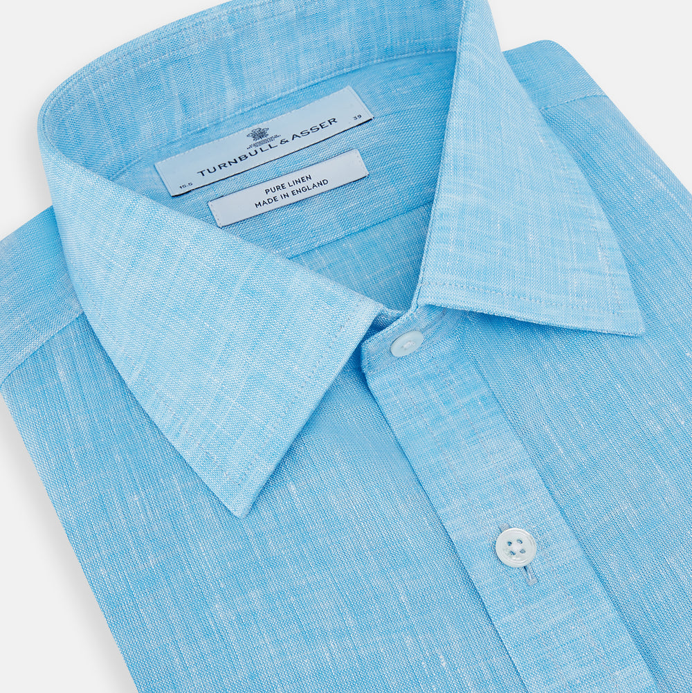 The Turnbull & Asser Turquoise Linen Mayfair Shirt features long sleeves and a collar, displayed neatly on a white background.