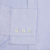 View 4 of product A Blue and White Fine Bengal Stripe Sea Island Quality Cotton Shirt by Turnbull & Asser, featuring a T&A collar and 3-button cuffs, is laid flat on a white background.