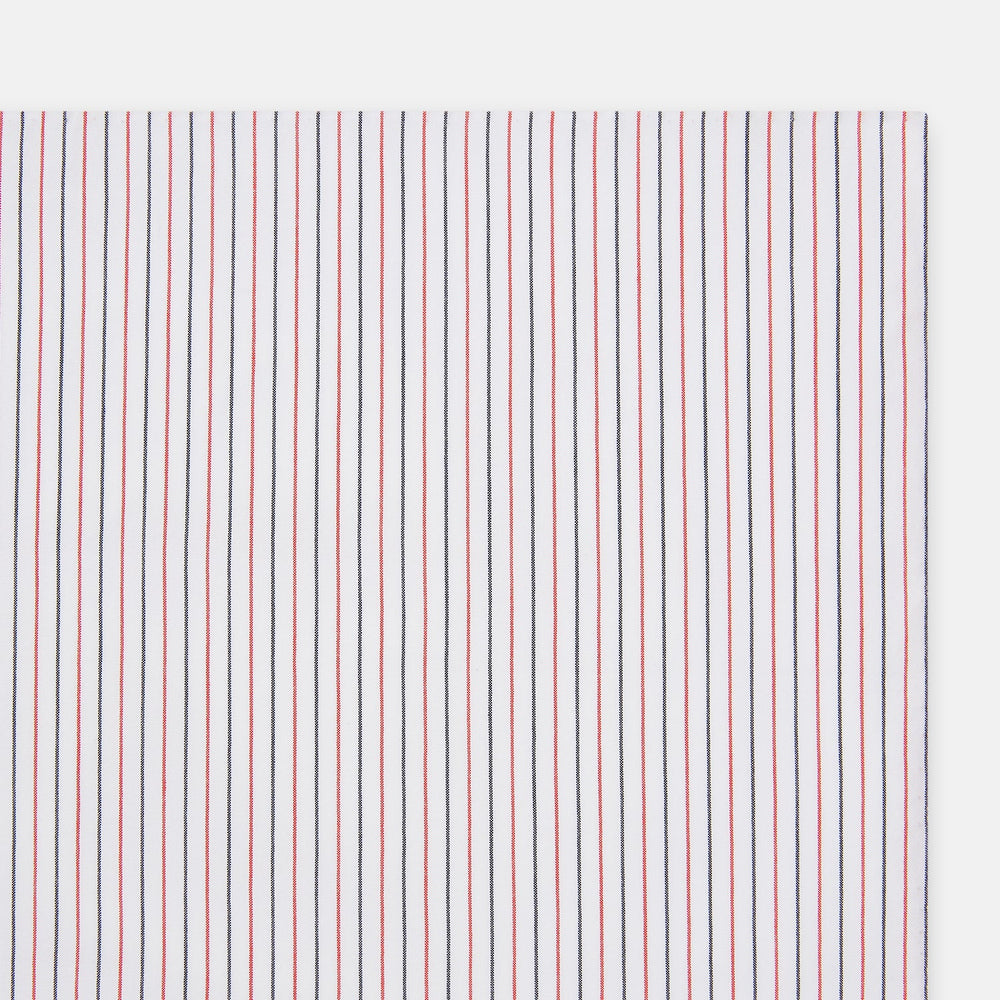 The Turnbull & Asser Hand Rolled Red and Navy Pinstripe Handkerchief features evenly spaced vertical stripes on white cotton, offering a clean, classic look as an elegant gentleman's accessory or stylish pocket square.