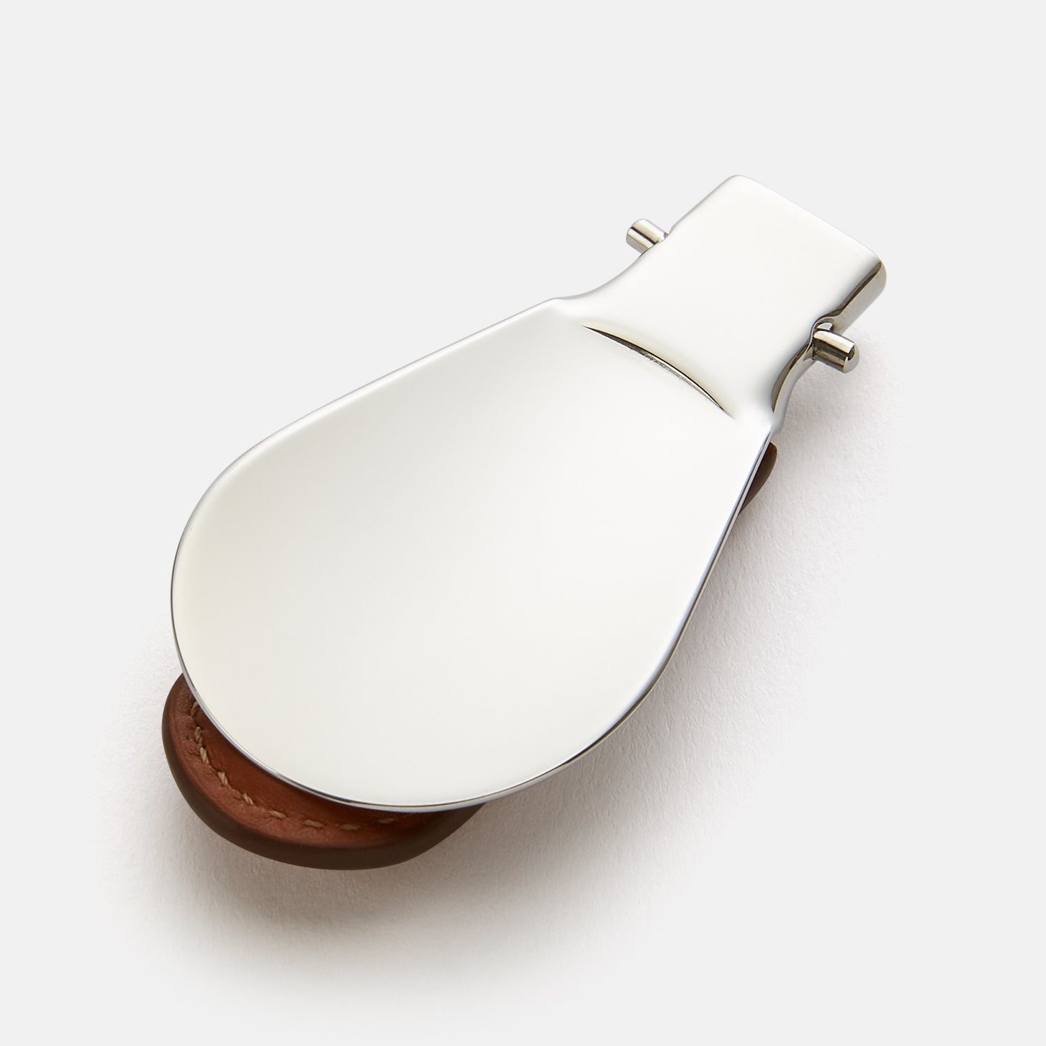 View 2 of product The Turnbull & Asser Camel Travel Shoe Horn features a wide, shiny silver blade and a brown Italian leather handle, displayed on a plain light background.