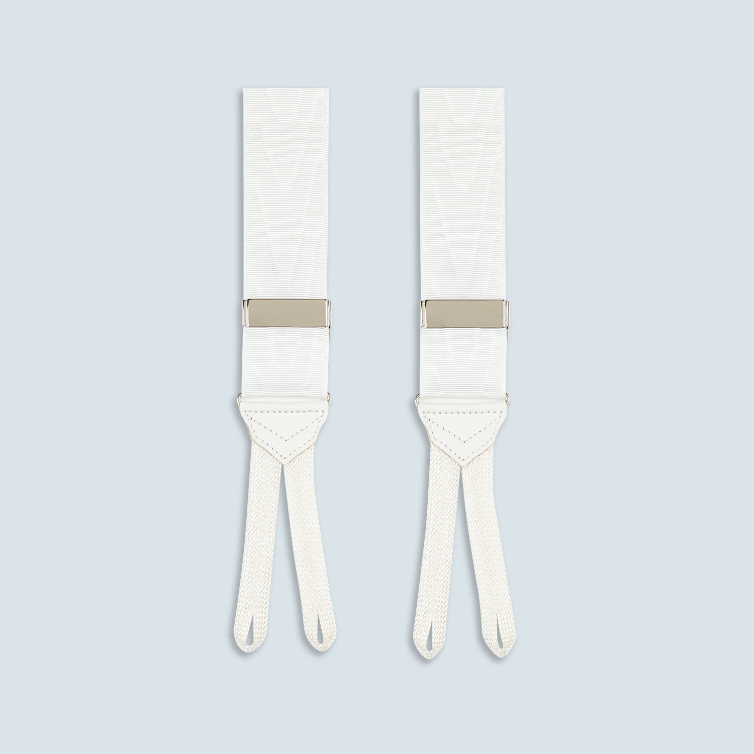 View 4 of product Turnbull & Asser White Adjustable Formal Braces with silver buckles and split leather ends, made in England, displayed on a light gray background.