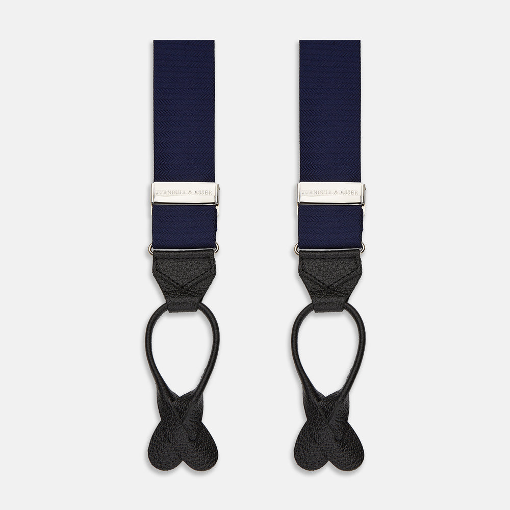 Turnbull & Asser Navy Silk Braces laid flat on a white background, featuring black leather loops, silver hardware, and an adjustable design.