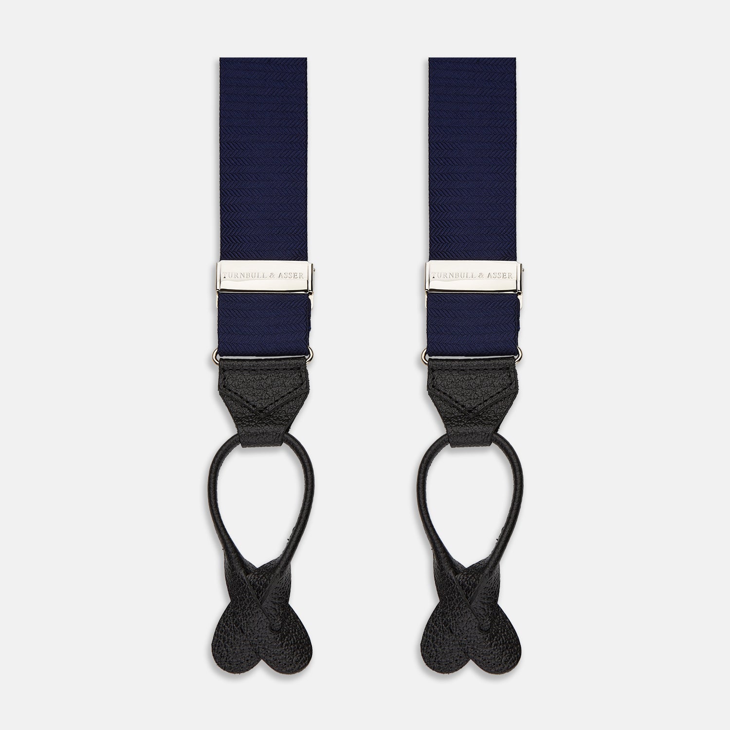 View 1 of product Turnbull & Asser Navy Silk Braces laid flat on a white background, featuring black leather loops, silver hardware, and an adjustable design.