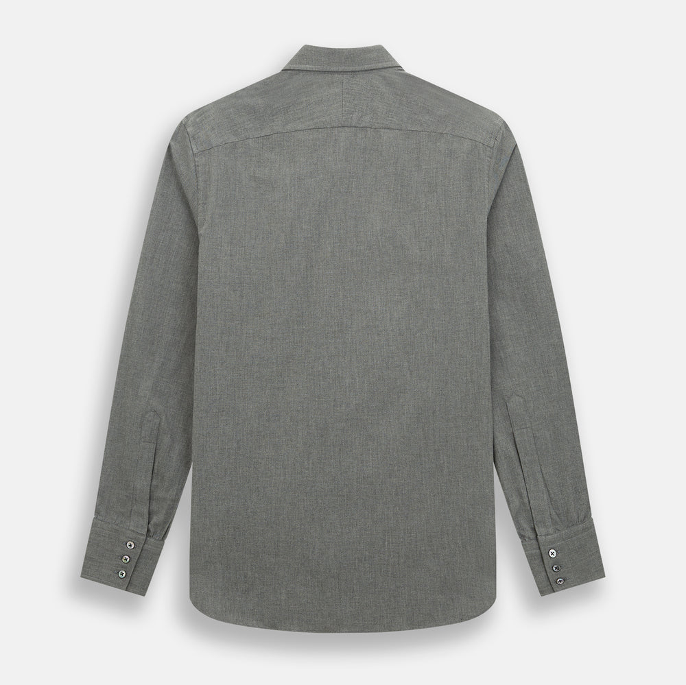 The Pale Charcoal Westminster Shirt by Turnbull & Asser features British craftsmanship with a tailored silhouette, long sleeves, pointed collar, buttoned cuffs, and a solid pale charcoal hue, elegantly shown against a white background.