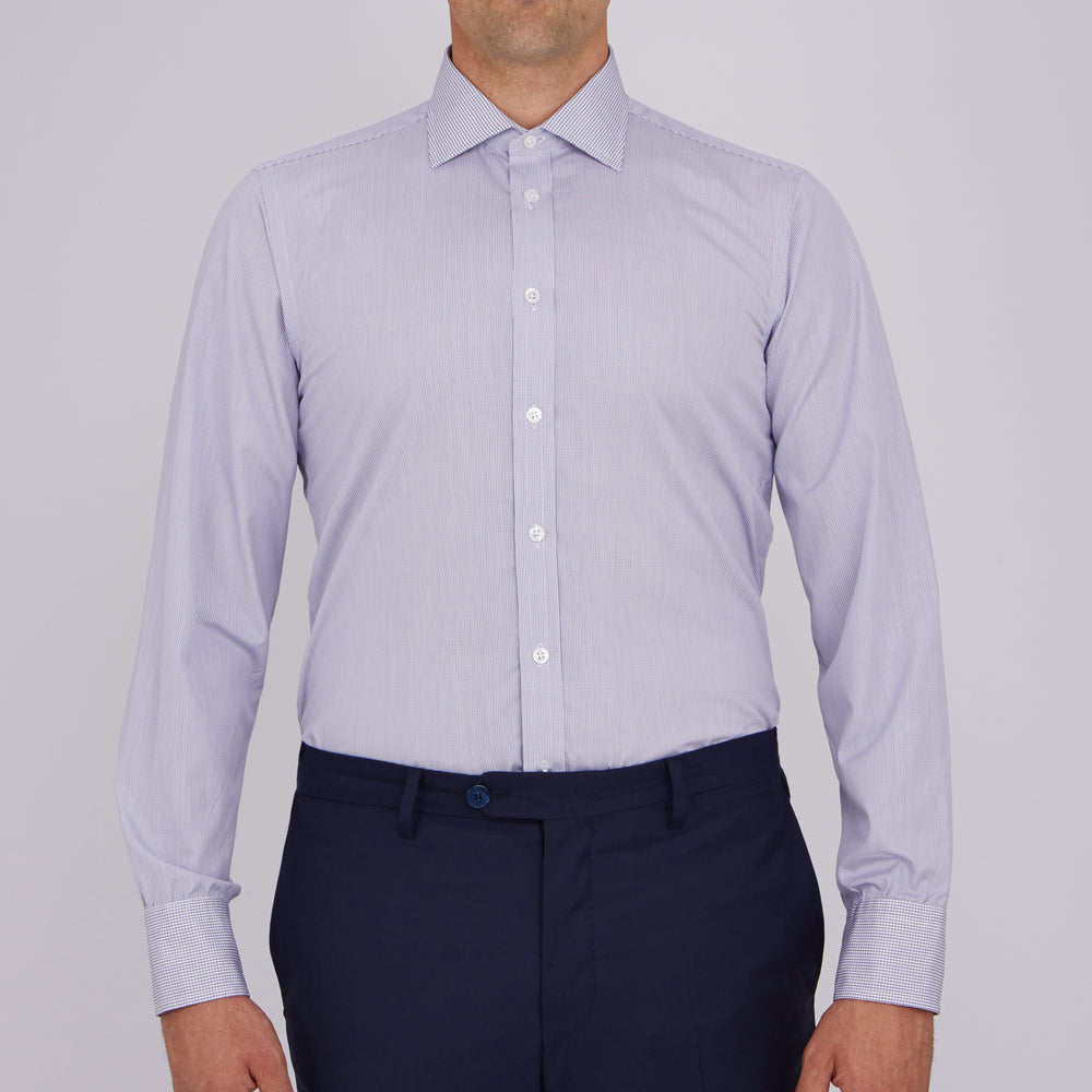 The Turnbull & Asser Slim Fit Blue Checked Shirt features long sleeves, contrasting white buttons, a regent collar, and distinct blue check pattern detailing on the cuff.