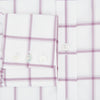 View 4 of product The Antique Pink Grid Check Mayfair Shirt by Turnbull & Asser is a long-sleeve shirt made from Italian cotton, featuring evenly spaced pink grid checks, displayed flat on a white background.