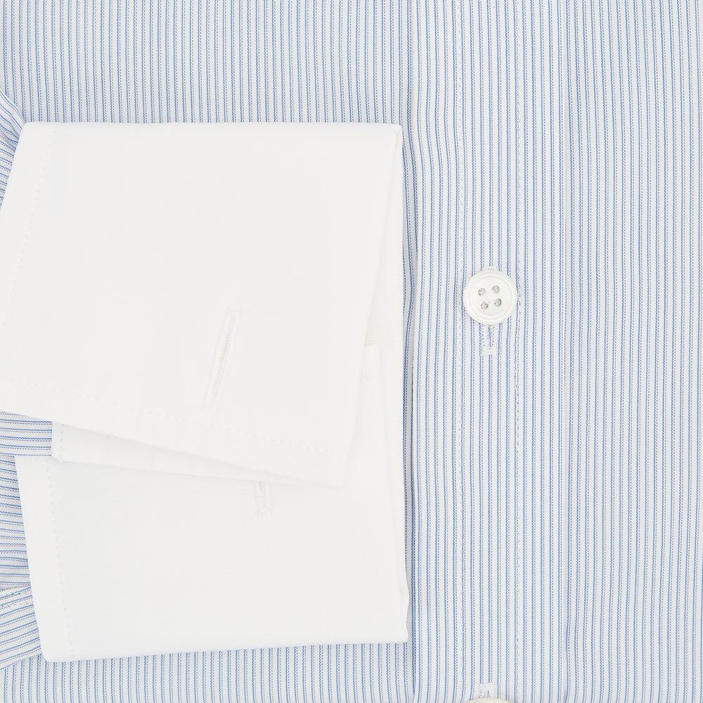 The Turnbull & Asser Sky Blue Hairline Multi Stripe Shirt features a contrast T&A collar and cuffs in white, Mayfair fit, and front buttons, displayed on a plain white background.