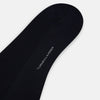 View 3 of product A single Turnbull & Asser Navy Micro Knit Long Sock is shown in a side profile against a plain white background, with the toe pointing downward and the cuff at the top.