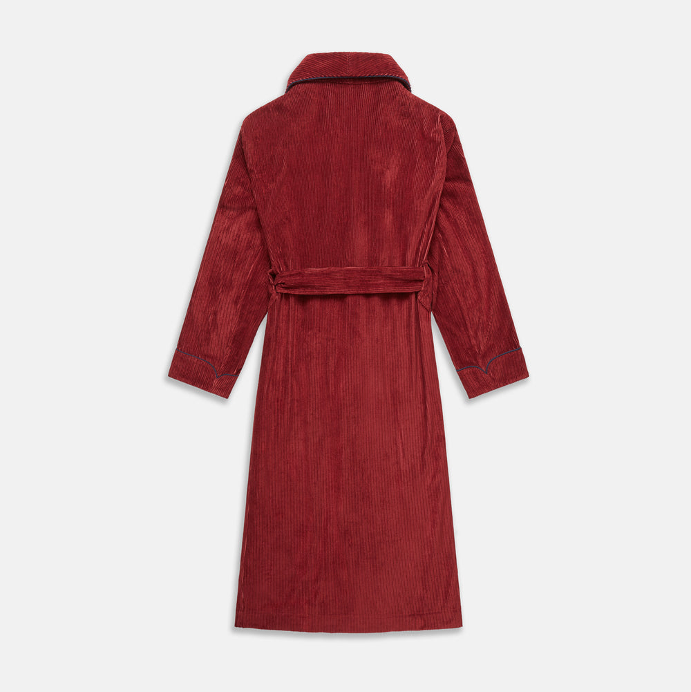The Turnbull & Asser Burgundy Linen & Cotton Cord Gown, expertly made in England, features a shawl collar, patch pockets, and a matching fabric belt—shown here on a white background.