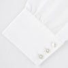 View 5 of product The Turnbull & Asser Two-Fold 120 White Shirt with a Regent collar and 3-button cuffs is neatly folded and displayed against a light blue background.