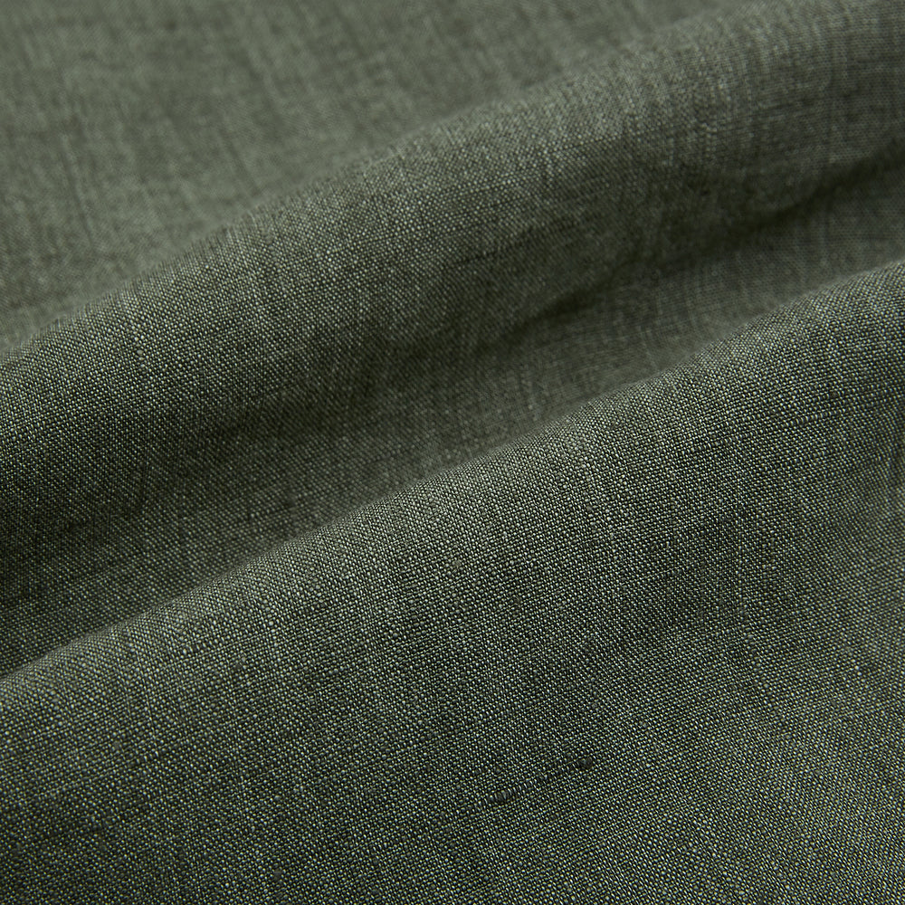 The Sage Linen Westminster Shirt by Turnbull & Asser features long sleeves, a button-up front with white buttons, a pointed Turnbull collar, and buttoned cuffs—crafted in Britain and shown here against a plain white background.