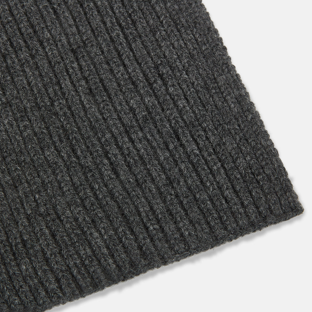 The Turnbull & Asser Graphite Rib-Knit Cashmere Scarf, a luxury winter accessory, is shown neatly looped against a plain white background.