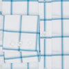 View 4 of product The Turnbull & Asser Turquoise Grid Check Mayfair Shirt is crafted from Italian cotton with a white base and turquoise grid pattern, featuring long sleeves, a pointed collar, and buttoned cuffs.
