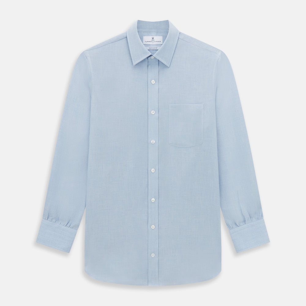The Turnbull & Asser Pale Blue Cotton Cashmere Derby Collar Richmond Shirt features a soft cotton-cashmere blend, derby collar, white buttons, left chest pocket, and buttoned cuffs, shown laid flat on a white background.