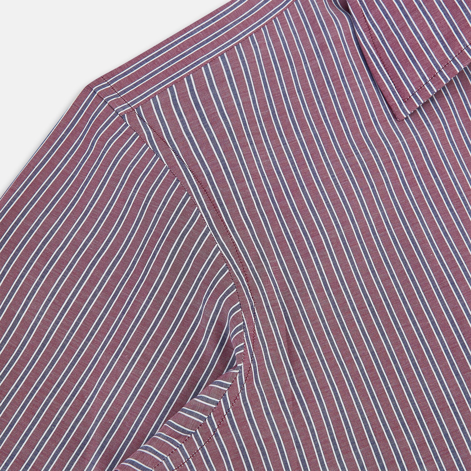 Image 6 of product The Turnbull & Asser Wine Ticking Stripe Westminster Shirt features red, blue, and white vertical pinstripes on white and is shown laid flat on a white surface.