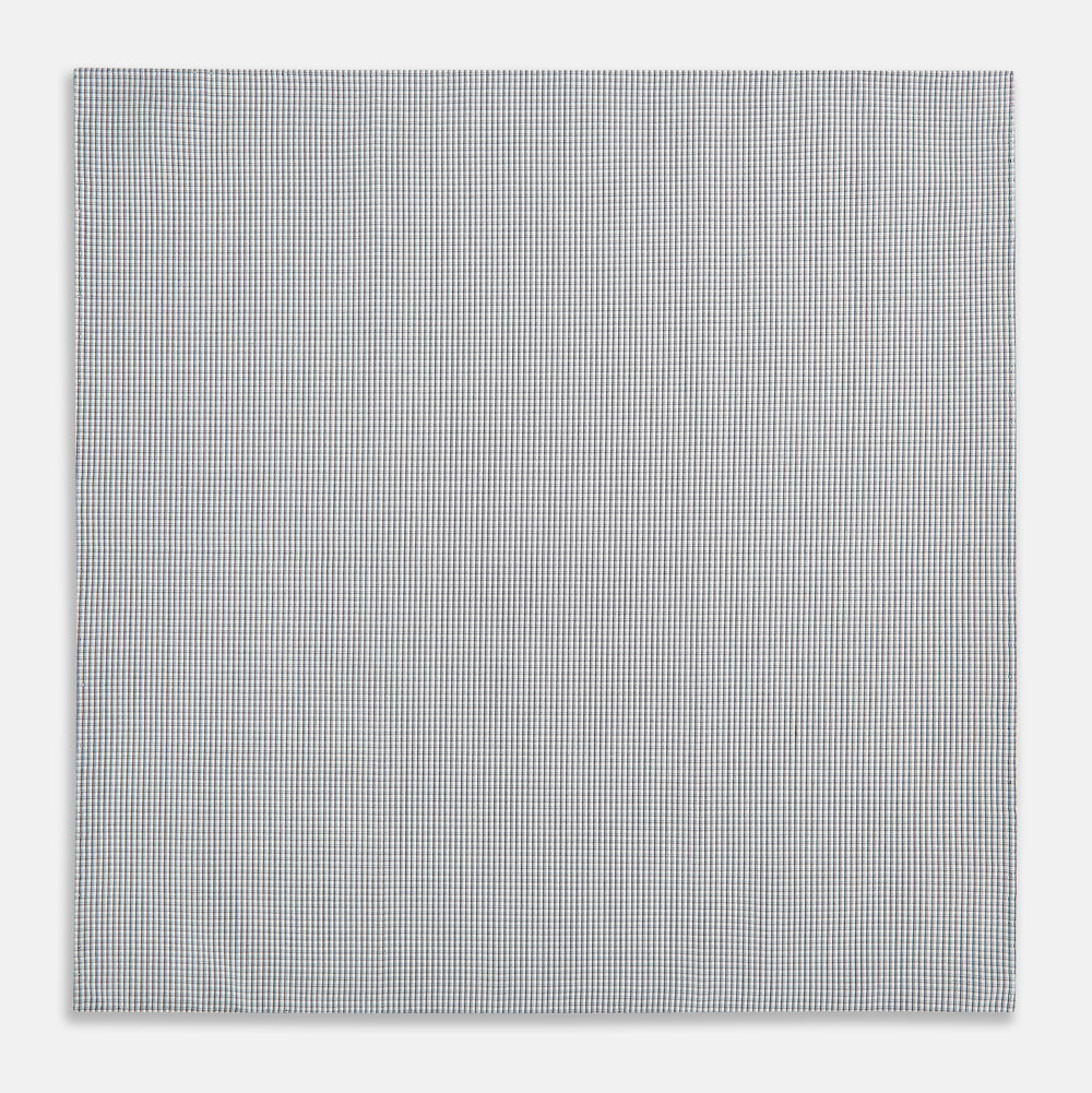 The Turnbull & Asser Navy Blue Shadow Grid Check Hand-Rolled Handkerchief showcases a small, evenly spaced blue and white check pattern and hand-rolled edges, neatly displayed against a white background.