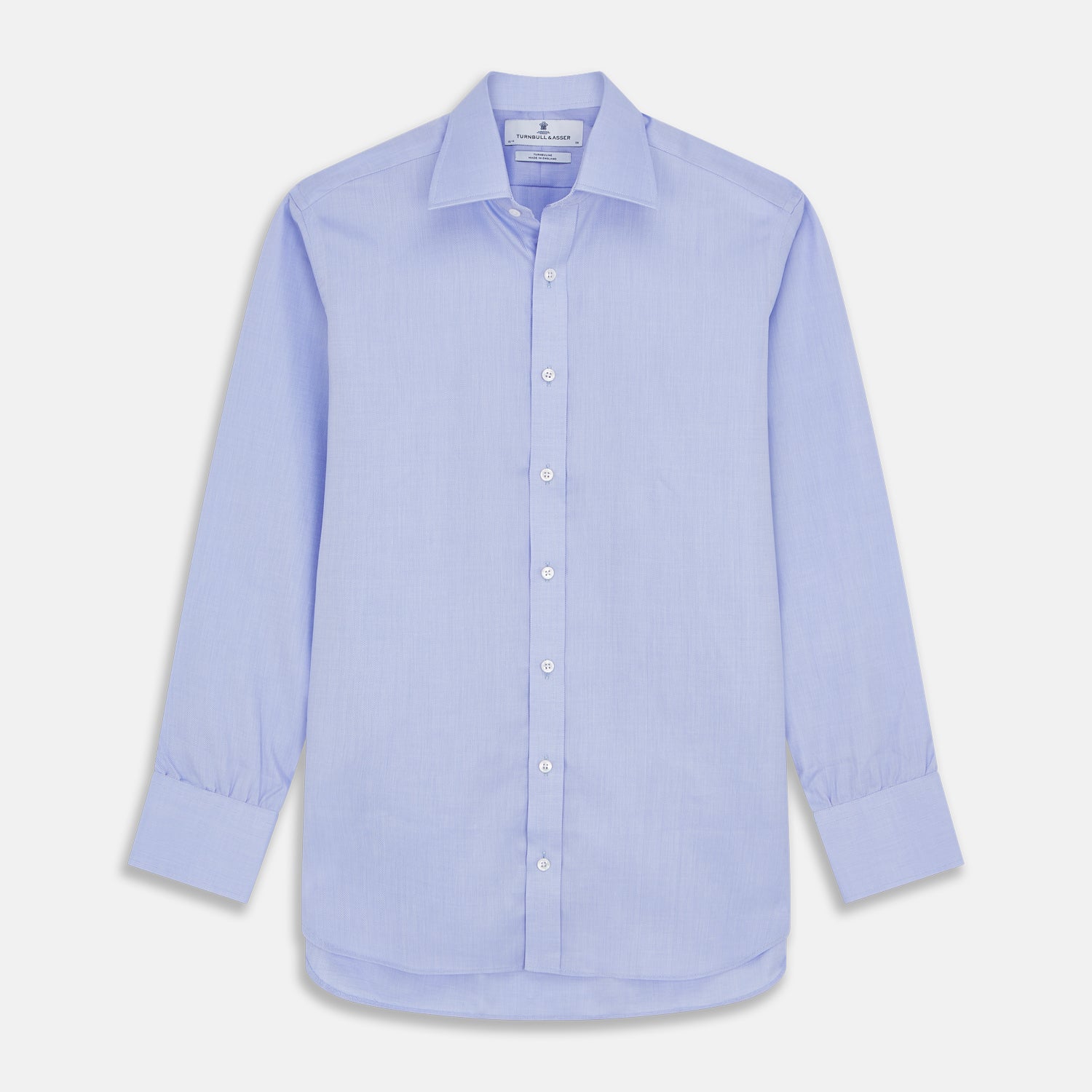 View 1 of product The Turnbull & Asser Blue Herringbone Regular Fit Shirt features a classic Kent collar, long sleeves, white buttons, and buttoned cuffs. Displayed on a white background, it's the perfect formal shirt for any occasion.