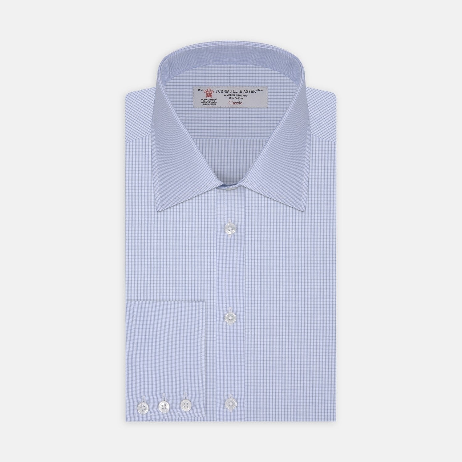 View 2 of product A circular swatch of Turnbull & Asser’s Light Blue Fine Check Cotton Fabric, featuring a fine vertical white grid on light blue, is bordered by a thin gray outline and shown against a plain white background.