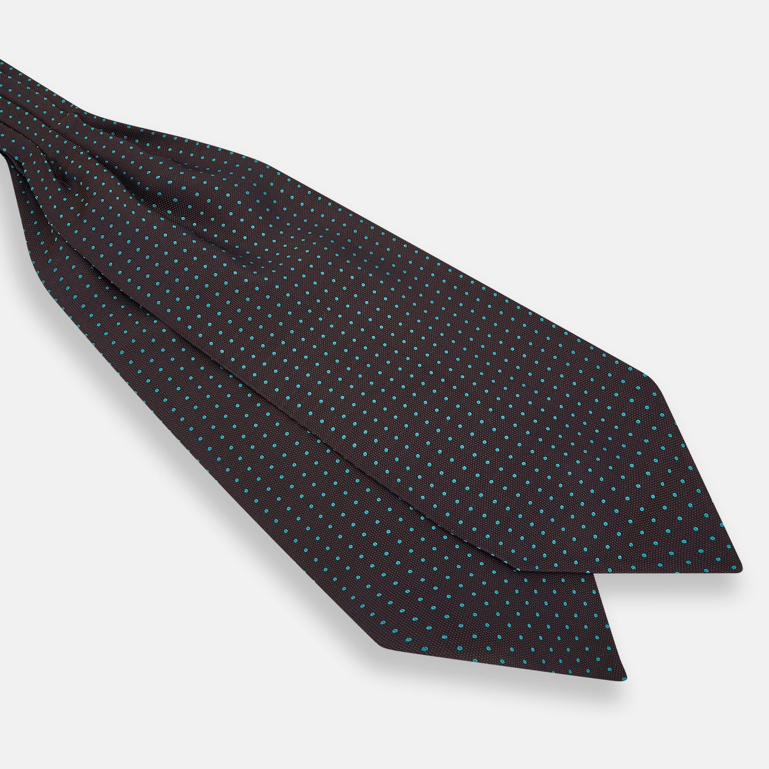 View 3 of product The Turnbull & Asser Blue and Dark Brown Micro Dot Silk Cravat features evenly spaced blue micro dots on dark brown silk, displayed neatly folded on a white background.