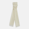View 1 of product The Turnbull & Asser White Hand-Dyed Cashmere Scarf is sheer, lightweight, and shown hanging with a loose knot against a plain white background.