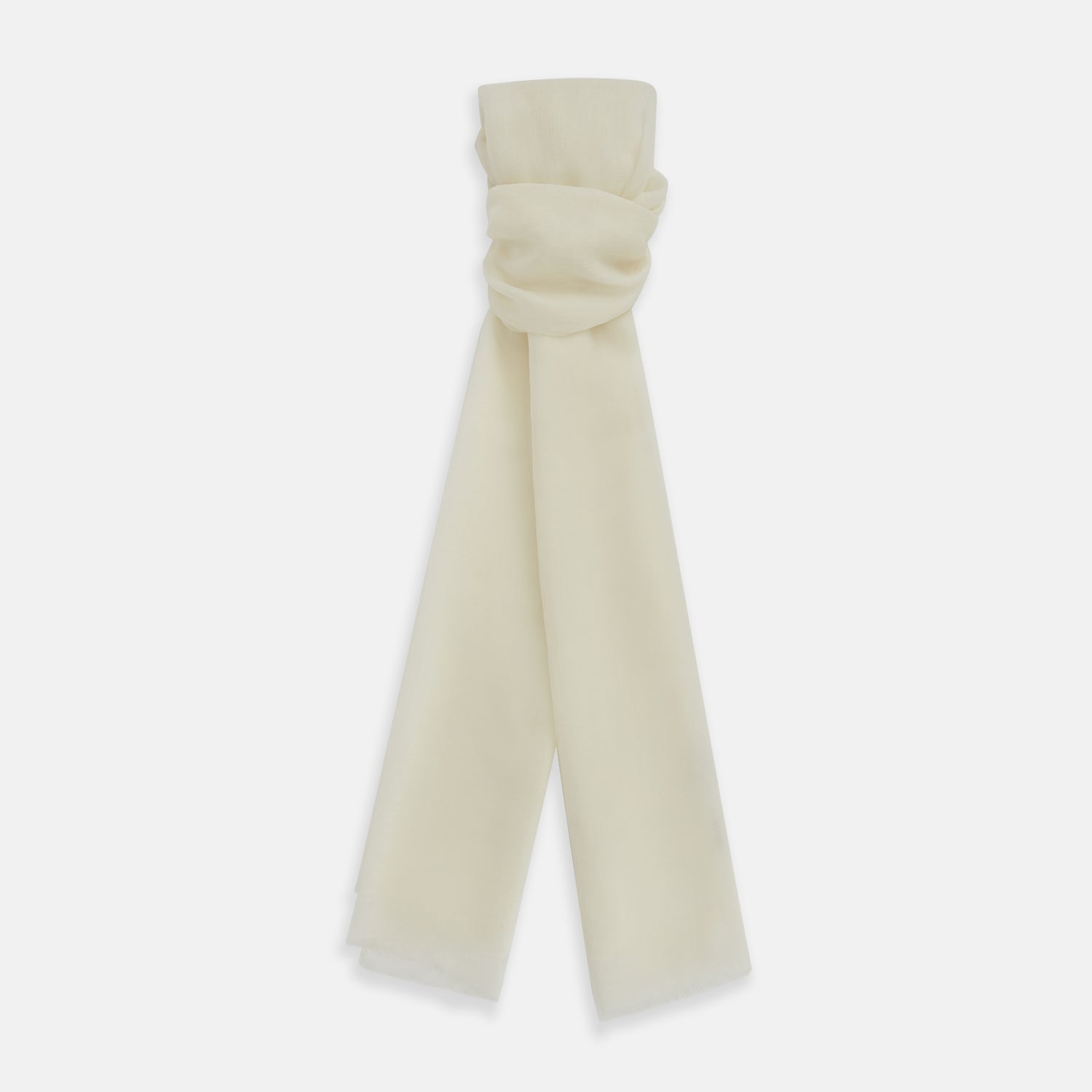 View 1 of product The Turnbull & Asser White Hand-Dyed Cashmere Scarf is sheer, lightweight, and shown hanging with a loose knot against a plain white background.