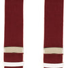 View 5 of product A pair of Turnbull & Asser Bordeaux Adjustable Felt Braces, featuring white leather ends and gold metal adjusters, made in England, are displayed vertically on a plain white background.