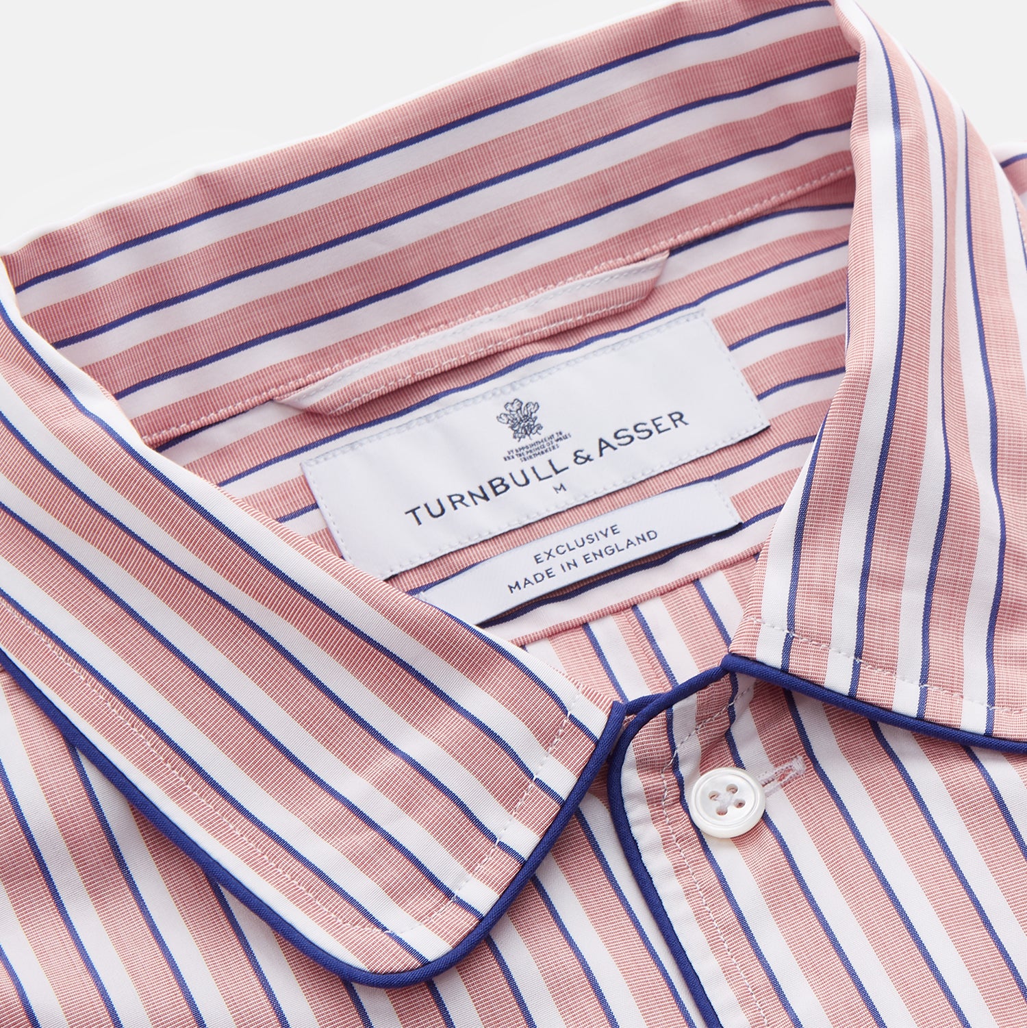 View 4 of product The Orange Multi Stripe Cotton Sussex Nightshirt by Turnbull & Asser features a classic collar, red and white vertical stripes, a chest pocket with blue trim, button-down front, and curved hem—a luxe take on the traditional nightshirt.