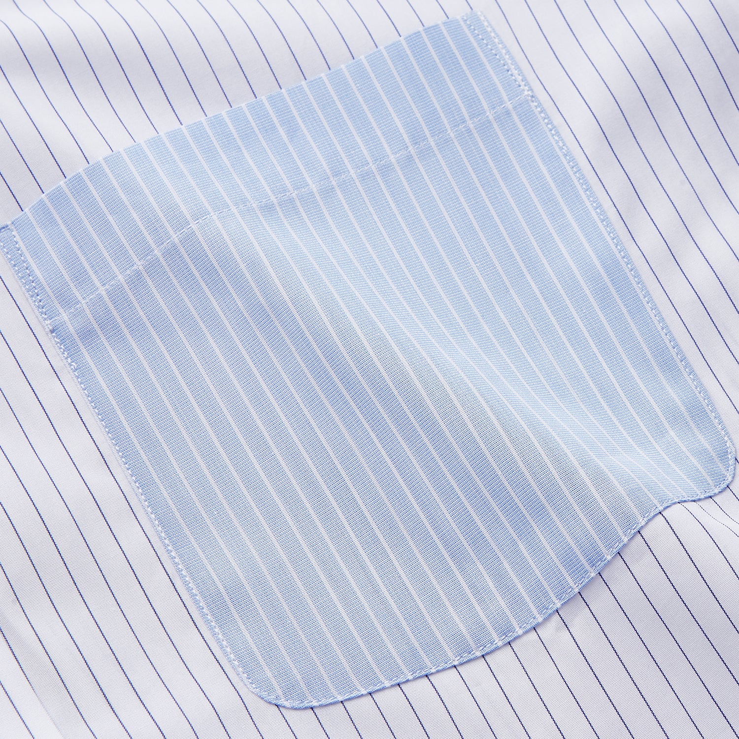 View 2 of product The White and Blue Stripe Cotton RE-PURPOSE Weekend Fit Finch Shirt by Turnbull & Asser features long sleeves, thin blue stripes, a light blue chest pocket, and is crafted sustainably.