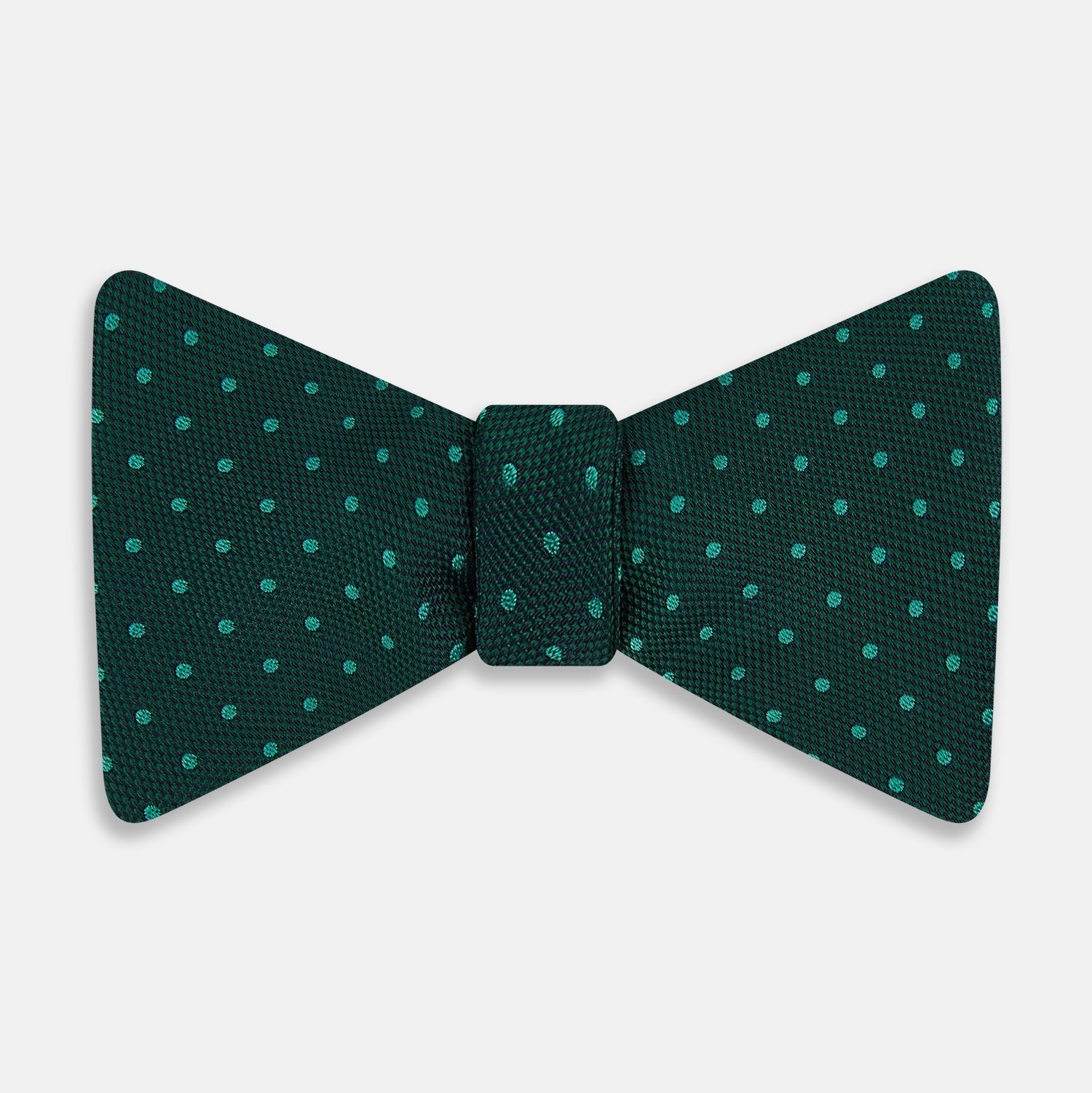 View 1 of product The Turnbull & Asser Dark Green and Navy Micro Dot Silk Bow Tie, featuring a refined dotted pattern, is showcased on a plain white background—an elegant accessory perfect for any occasion.
