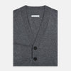 View 4 of product The Turnbull & Asser Grey Melange Cashmere Cardigan features a V-neck, ribbed cuffs and hem, front buttons, and two pockets—an elegant piece from our timeless knitwear collection. Shown here against a plain white background.
