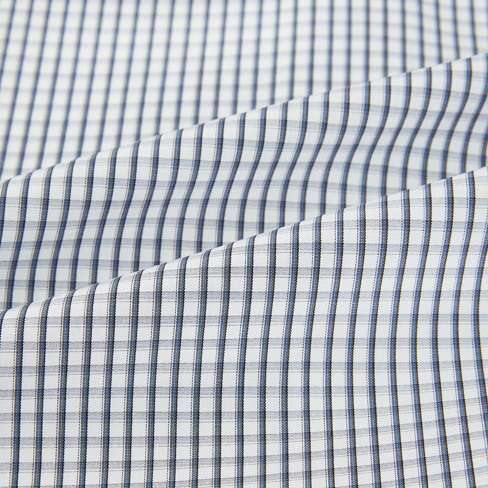 The Grey Double Graph Mayfair Shirt by Turnbull & Asser is a long-sleeve, button-down cotton shirt with a black and white double graph check, chest pocket, and classic collar.