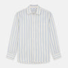 View 2 of product A close-up of Turnbull & Asser's Blue and Off-White Stripe Cotton Fabric, featuring wavy blue stripes on white, displayed in a circular gray border against a light background.