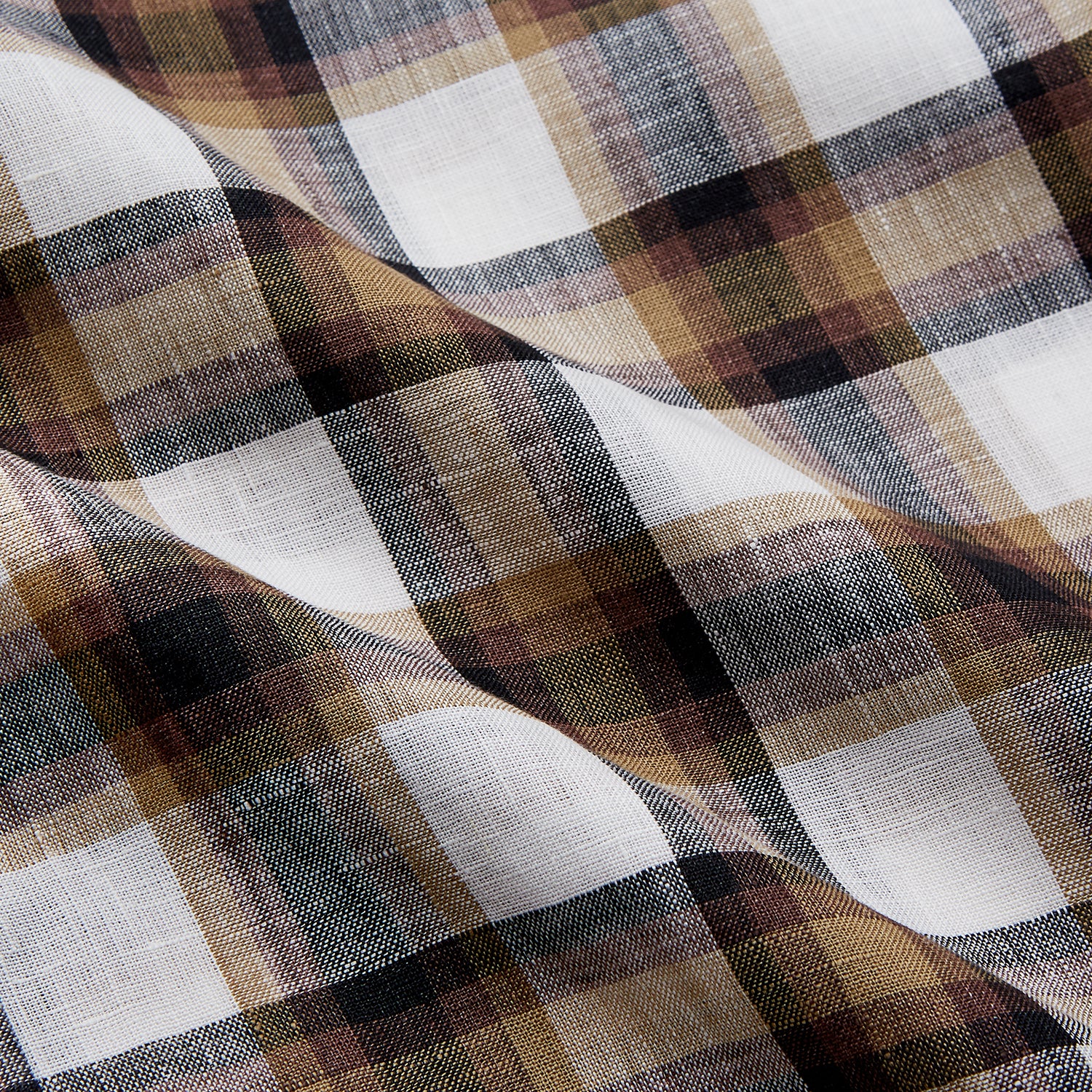 View 4 of product The Turnbull & Asser Brown Multi Check Linen Weekend Fit Hayne Shirt is a long-sleeve, button-up with a Dorset collar and buttoned cuffs, shown flat on a white background. It features a classic plaid pattern.