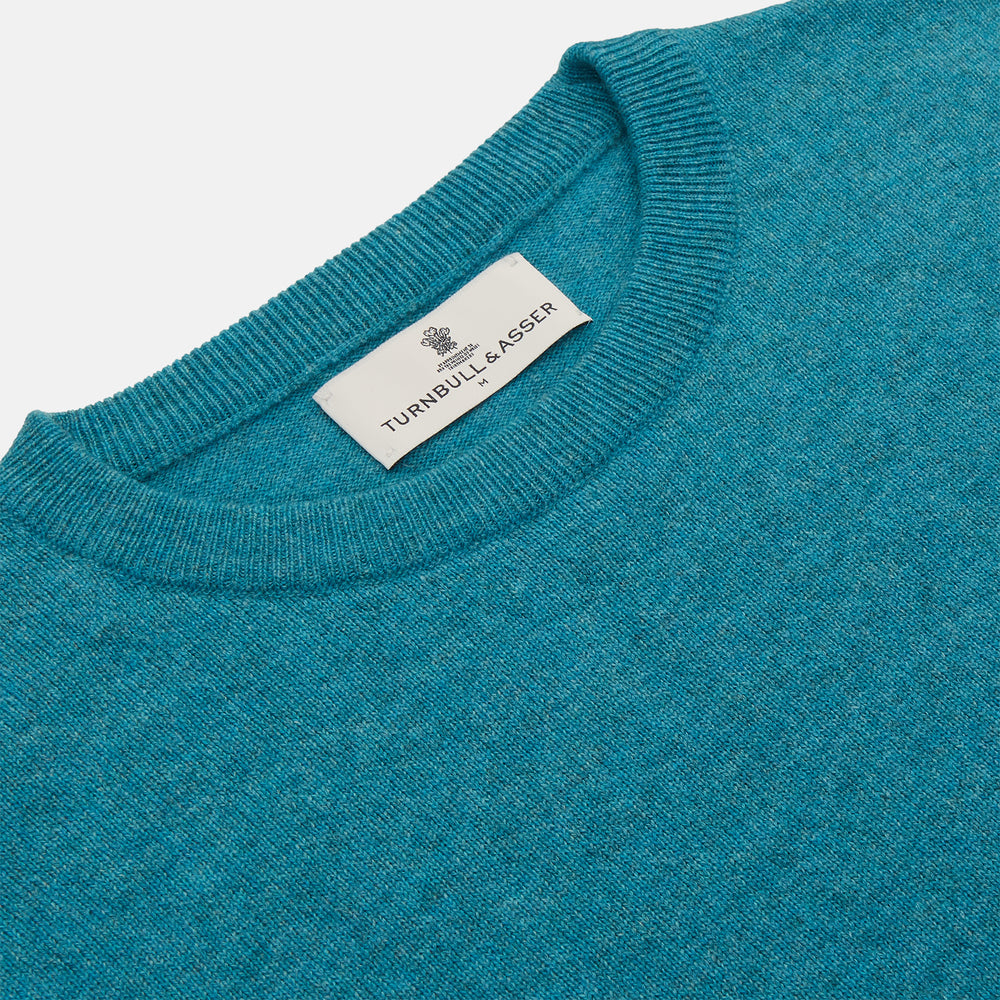 The Teal Glenn Crew Neck Jumper by Turnbull & Asser is shown against a white background, featuring a classic long-sleeve design with ribbed cuffs, collar, and hem.