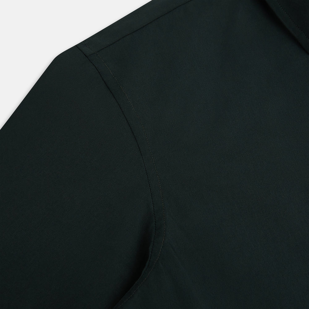 The FOREST GREEN WINDSOR SHIRT by Turnbull & Asser features long sleeves, a Windsor collar, and buttoned cuffs, reflecting British craftsmanship. Displayed on a plain white background.