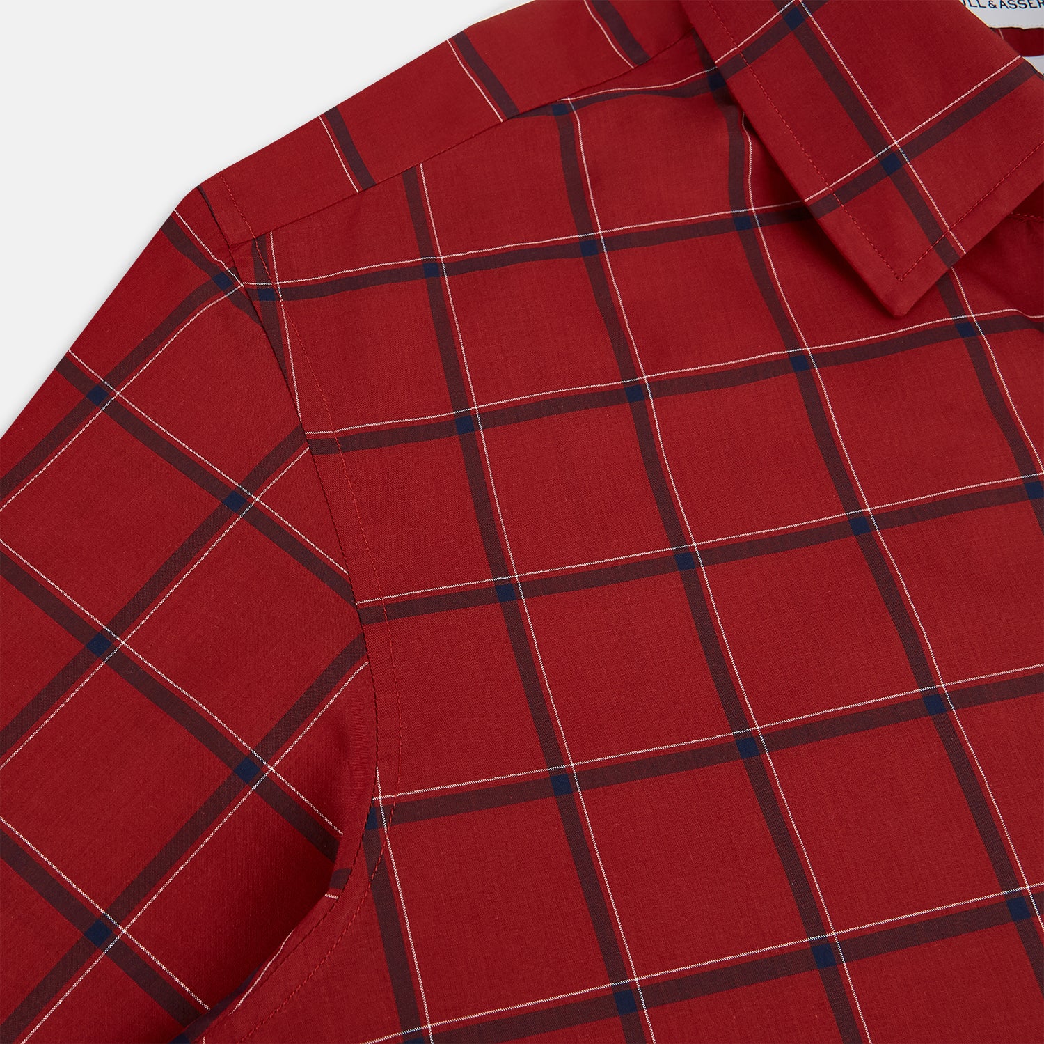 View 6 of product The Turnbull & Asser Dark Red Grid Check Windsor Shirt is a long-sleeved, button-up shirt with a dark red base and black and white grid pattern, displayed flat on a white background.