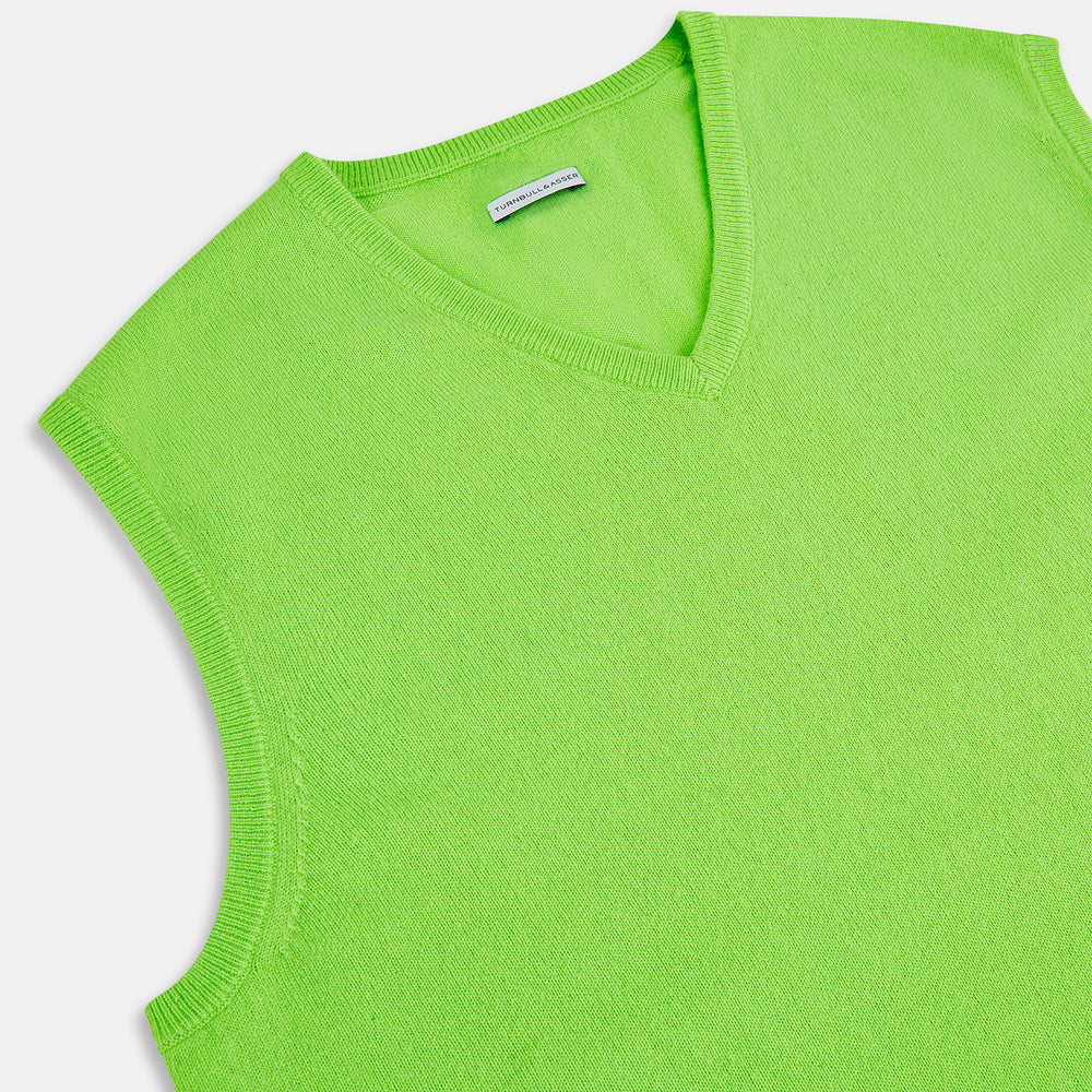 The Turnbull & Asser Lime Green V-neck Cashmere Vest features a sleeveless design and ribbed edges, shown against a plain white background.