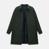View 4 of product A Forest Green John Arthur Trench Coat by Turnbull & Asser, knee-length with a single-breasted button closure, three zippered pockets, and buttoned cuffs, is laid flat on a white background.