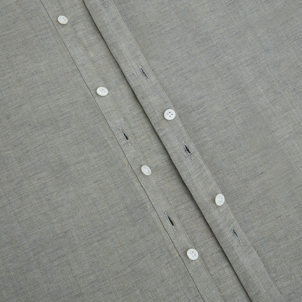 The Flint Grey Linen Westminster Shirt by Turnbull & Asser features long sleeves, a pointed Westminster collar, white buttons, and fine British craftsmanship, shown on a plain white background.