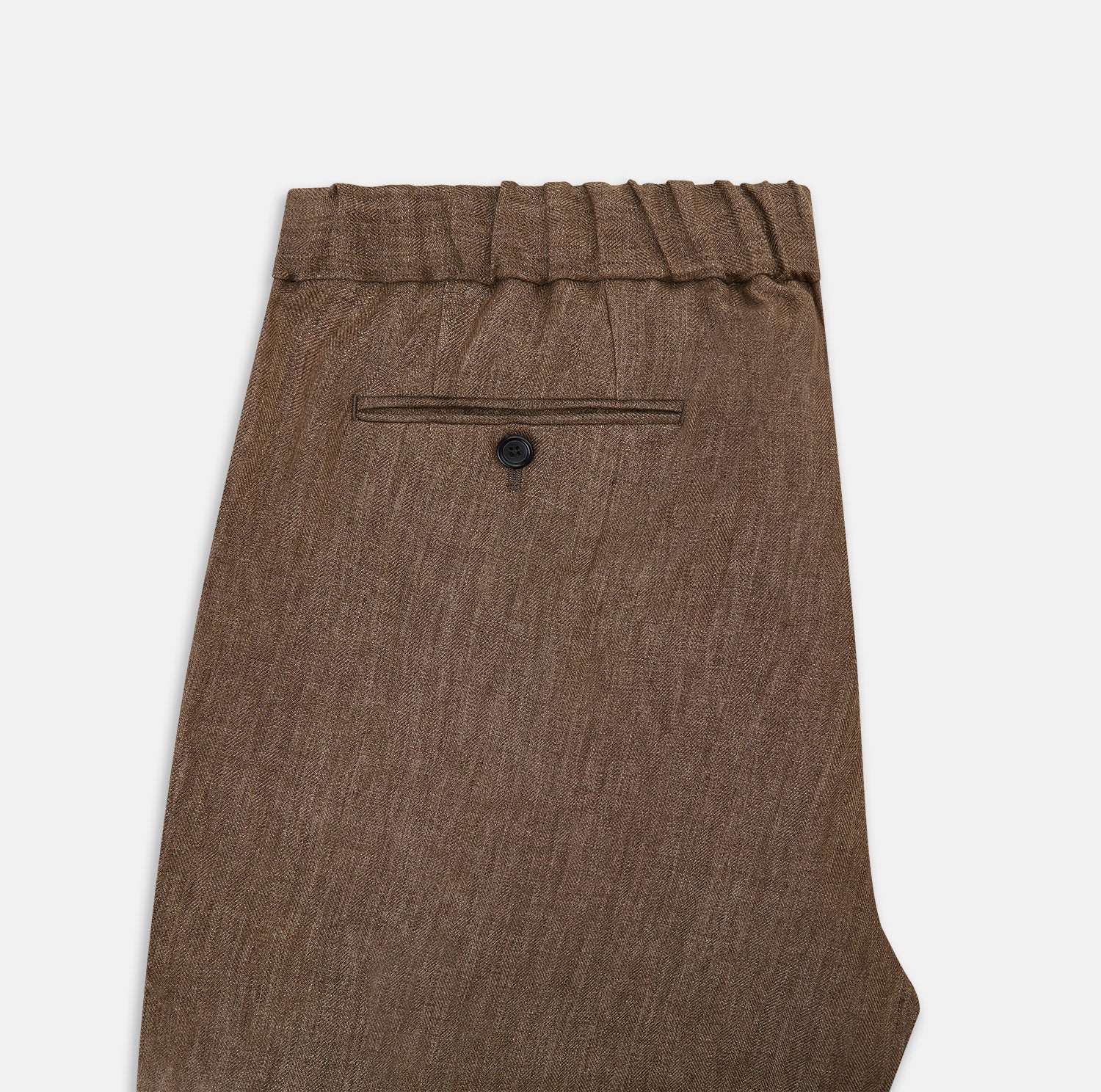 View 5 of product The Turnbull & Asser Pine Cone Linen Herringbone Miles Trousers feature a relaxed fit, elasticated waistband, and drawstring tie, shown against a plain white background.