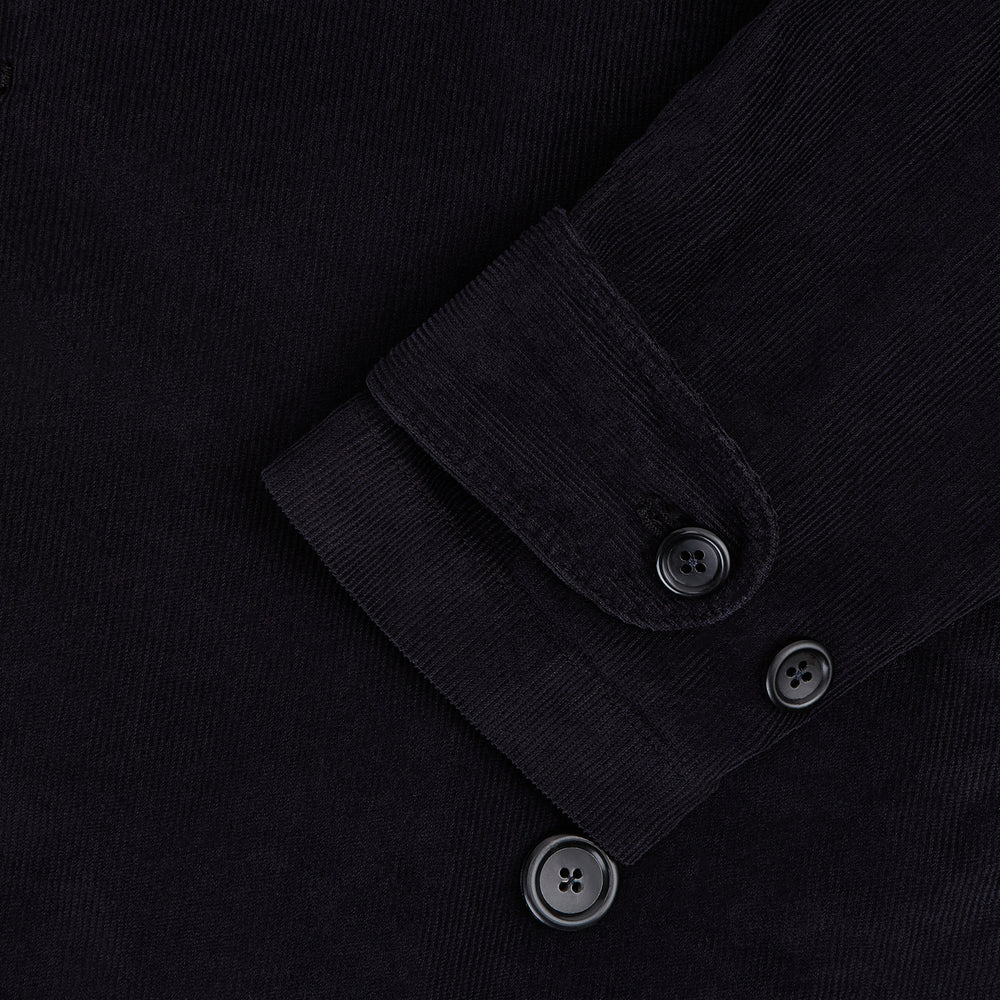 The Navy Kingston Corduroy Caban Jacket by Turnbull & Asser features six front buttons, a notched collar, chest pocket, and buttoned cuffs, showcased against a plain white background.