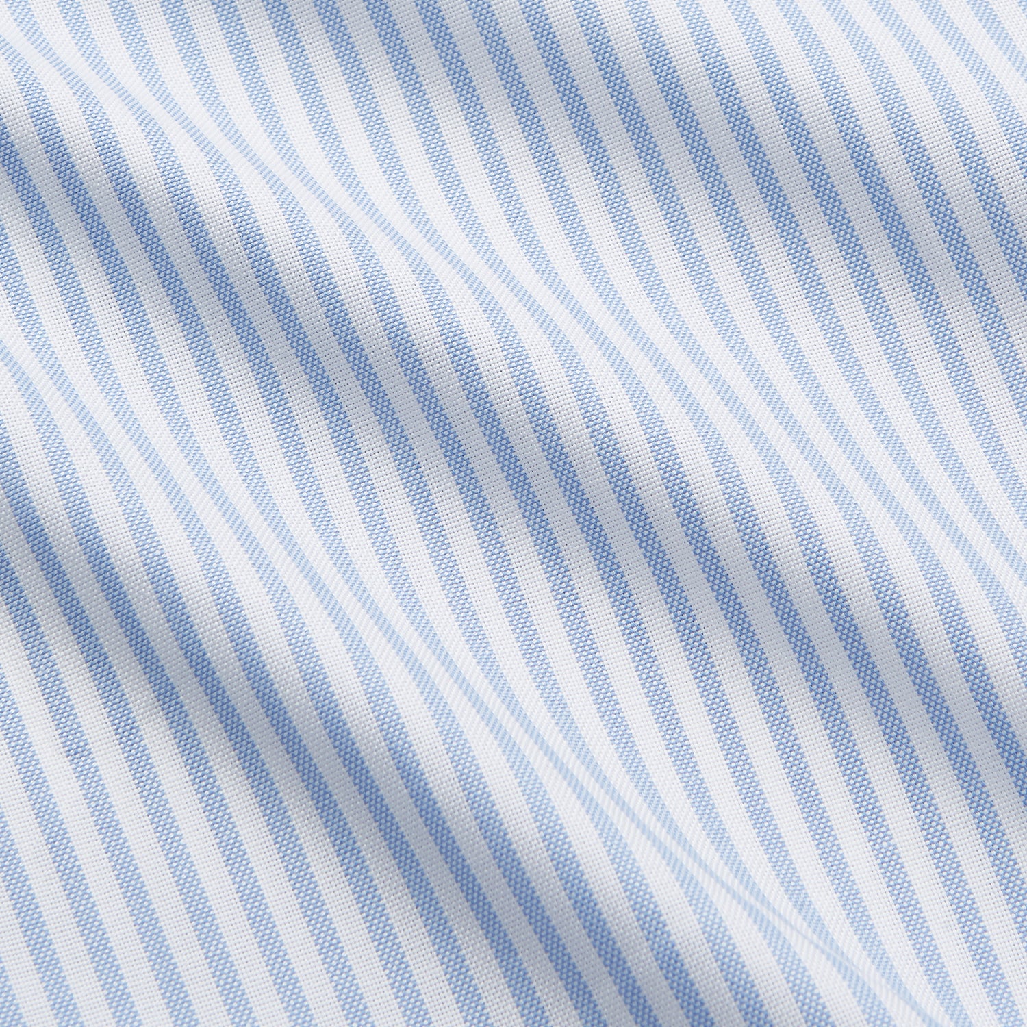 View 5 of product The Turnbull & Asser Pale Blue Stripe Weekend Fit Hayne Shirt features a Dorset collar, 1-button cuffs, and vertical stripes, shown laid flat against a white background.