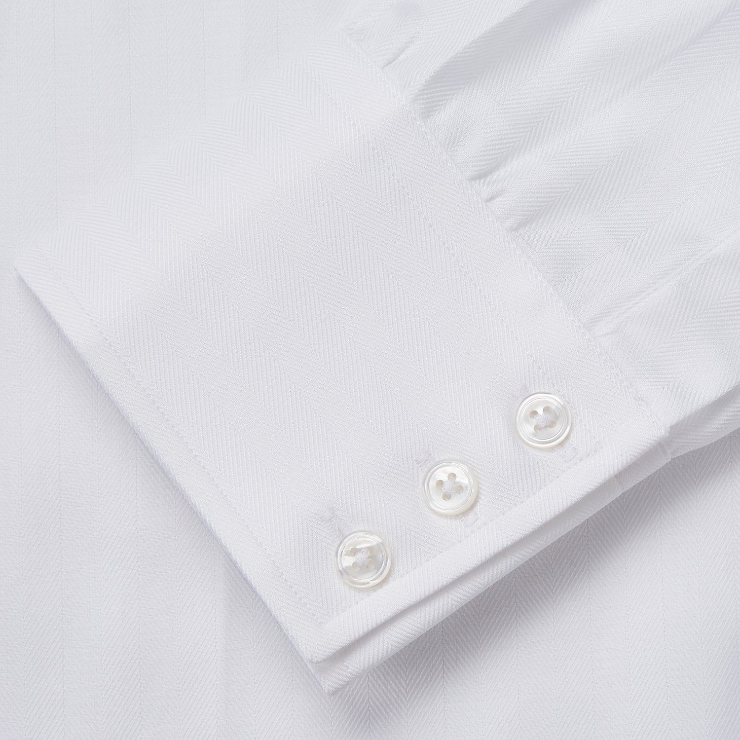 View 4 of product The Turnbull & Asser White Herringbone Tailored Fit Shirt with a Kent collar is displayed against a white background.