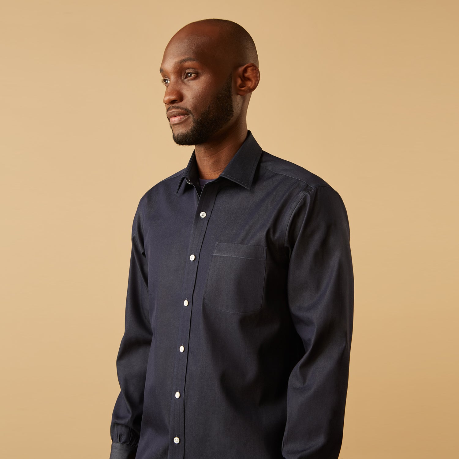 View 7 of product The Turnbull & Asser Blue Weekend Fit Finch Shirt features a Derby collar, chest pocket, classic white buttons, and timeless style, all in cotton. Laid flat on a white background.