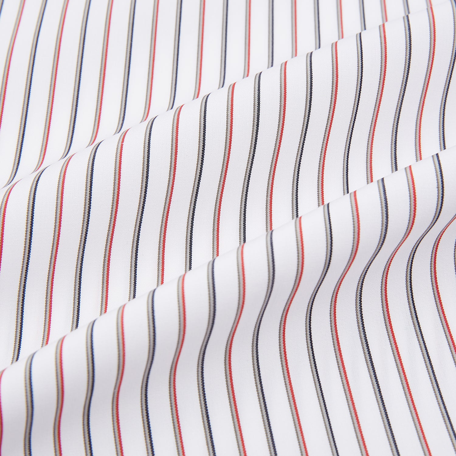 View 6 of product The Red Double Stripe Shirt with contrast T&A collar and cuffs by Turnbull & Asser features classic thin vertical red stripes and solid white collar and cuffs, laid flat on a white background for a timeless look.
