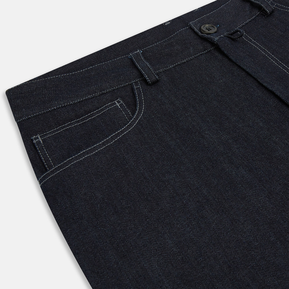 Turnbull & Asser Navy Denim Trousers feature a classic straight-leg cut, button and zipper closure, five-pocket workwear styling, and both front and back pockets, shown against a plain light background.