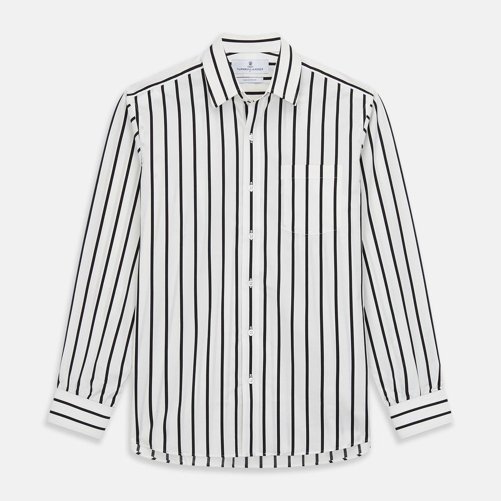 A close-up of Turnbull & Asser's Black & White Wide Stripe Cotton Fabric, featuring evenly spaced wavy black stripes on white, displayed in a circular frame against a plain background.
