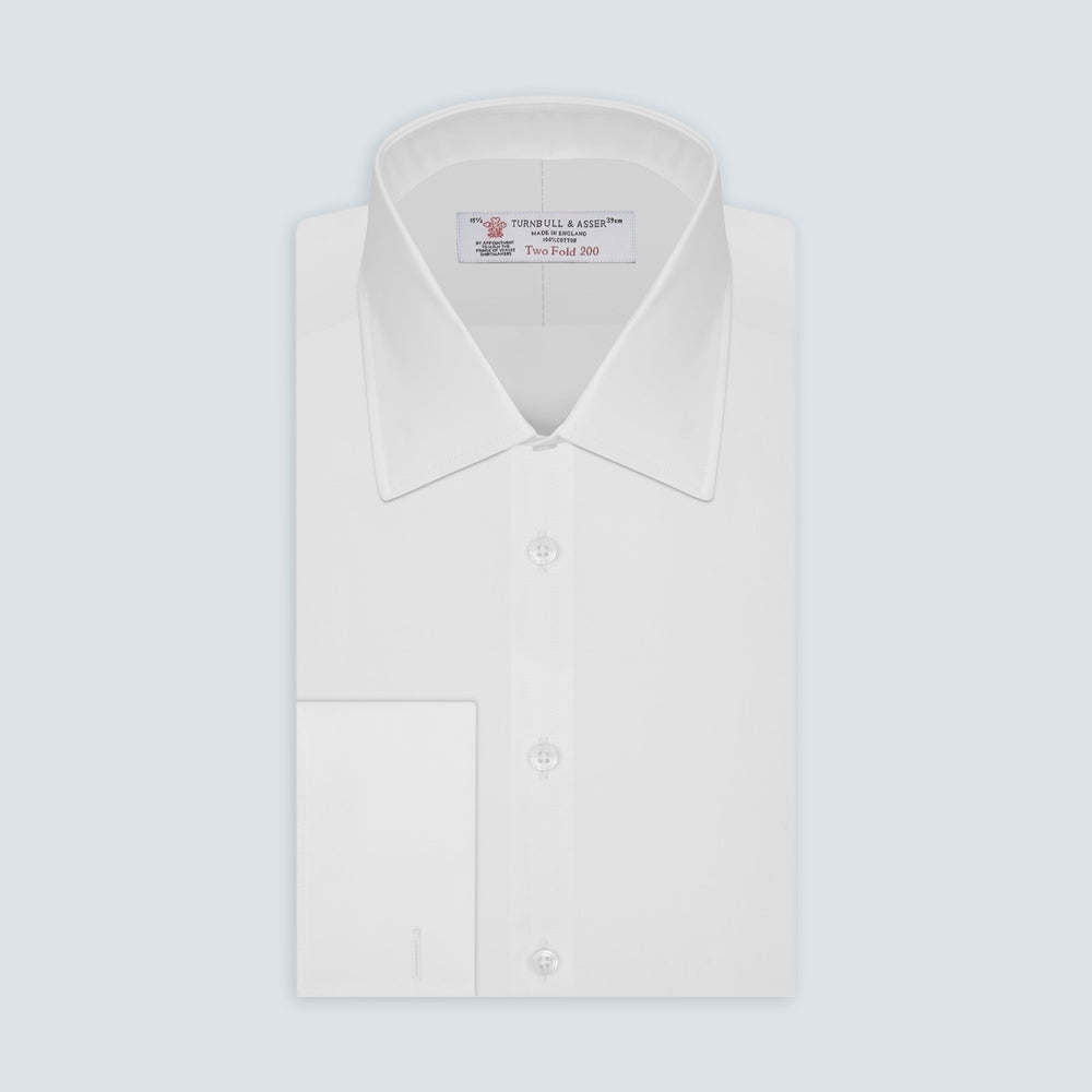 A round frame with a light gray border surrounds the White Two-Fold 200 Cotton Fabric by Turnbull & Asser, featuring a plain white surface with subtle texture and soft shading variations.